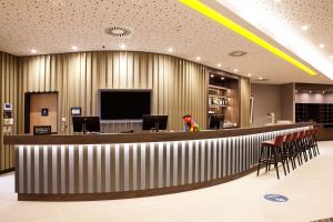 Hampton By Hilton Vienna Messe的电视和/或娱乐中心