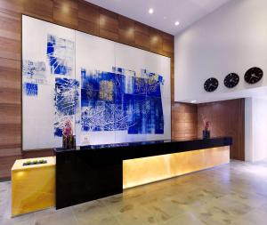 a lobby with blue and white art on the wall at DoubleTree by Hilton Zagreb in Zagreb