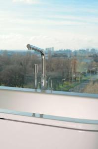 a sink in a window with a view of a city at DoubleTree by Hilton Zagreb in Zagreb