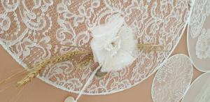 a close up of a lace curtain with a fan at Maison à deux pas de l'hôtel de ville in Calais +9 photos