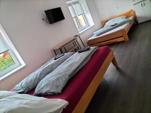 Postel nebo postele na pokoji v ubytování Horizont