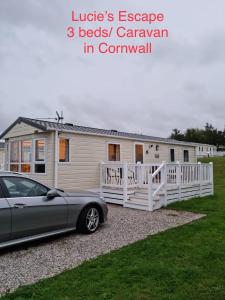 a house with a car parked in front of it at Lucie’s Escape/ 129 meadow view in Grampound