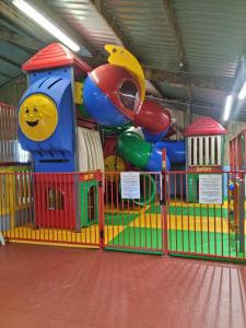 a play room with a playground with a inflatable at Lucie’s Escape/ 129 meadow view in Grampound