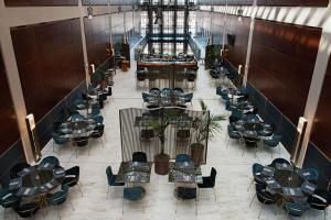 an overhead view of a restaurant with tables and chairs at DoubleTree by Hilton Turin Lingotto in Turin