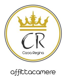 a gold crown logo with a letter c and a crown at CASA REGINA in Crevoladossola