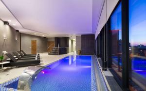 a swimming pool in the middle of a building at DoubleTree by Hilton Novosibirsk in Novosibirsk