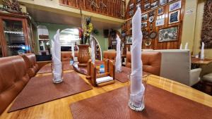 a dining room with a table with chairs and candles at Mirador de Bellavista Riobamba in Riobamba