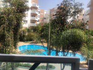 a view of a swimming pool from a balcony at Appartement meublé à louer in Settat +5 photos