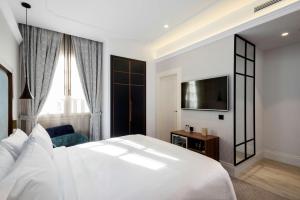 Łóżko lub łóżka w pokoju w obiekcie DoubleTree by Hilton Madrid-Prado