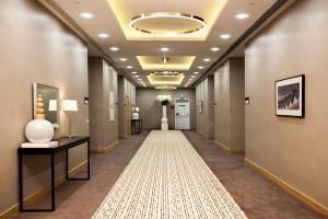 a hallway with a long hallway with a long hallway at Hilton Garden Inn Erzincan in Erzincan