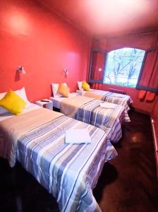 Tempat tidur dalam kamar di Hotel Windsor Mendoza