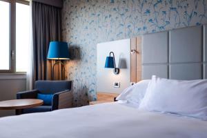 Postel nebo postele na pokoji v ubytování Hilton Strasbourg