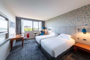 Postel nebo postele na pokoji v ubytování Hilton Strasbourg
