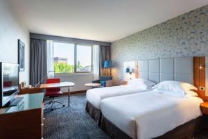 Postel nebo postele na pokoji v ubytování Hilton Strasbourg