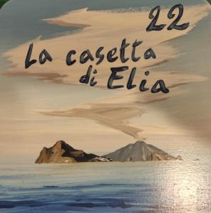 a painting of the ocean with the words la caja de elia at La Casetta di Elia in Lipari