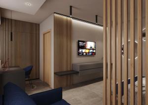 TV a/nebo společenská místnost v ubytování La Pergola Suites
