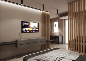 TV a/nebo společenská místnost v ubytování La Pergola Suites