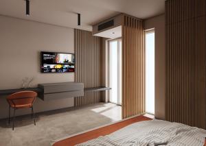TV a/nebo společenská místnost v ubytování La Pergola Suites