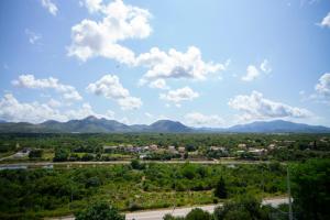 a view of a city with mountains in the background at Luxury Apartments Milićević in Trebinje