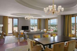 a dining room with a table and chairs at Hilton Dushanbe in Dushanbe