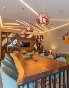 a conference room with a wooden table and chairs at Hampton by Hilton Aguascalientes Downtown in Aguascalientes