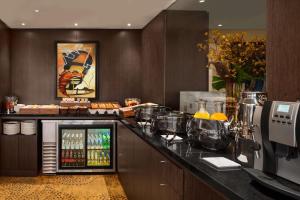 a kitchen with a counter with a drink cooler at Hilton Lima Miraflores in Lima