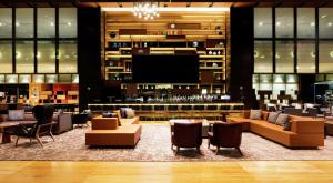 a lobby with couches and a flat screen tv at Hilton Mexico City Reforma in Mexico City