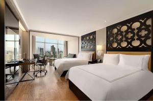 Rúm í herbergi á Hilton Lima Miraflores