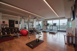 a fitness room with a gym with exercise equipment at Soro Montevideo, Curio Collection By Hilton in Montevideo