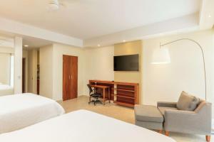 TV a/nebo společenská místnost v ubytování Hampton Inn & Suites by Hilton Los Cabos