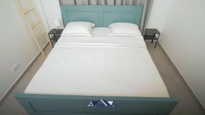 Katil atau katil-katil dalam bilik di Mathoera Residence