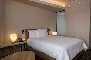 Cama ou camas em um quarto em Hilton Garden Inn Lima Miraflores