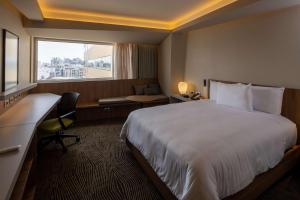 Cama ou camas em um quarto em Hilton Garden Inn Lima Miraflores
