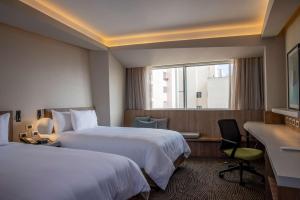 Cama ou camas em um quarto em Hilton Garden Inn Lima Miraflores