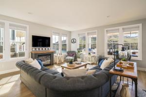 a living room with a couch and a fireplace at More Cowbell! #63 in Chelan