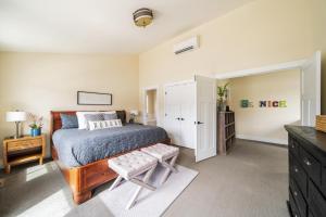 a bedroom with a bed and a dresser at More Cowbell! #63 in Chelan +38 photos