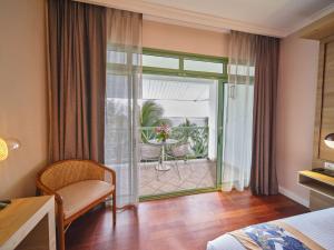 Кровать или кровати в номере Hilton Hotel Tahiti