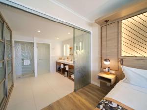 Кровать или кровати в номере Hilton Hotel Tahiti