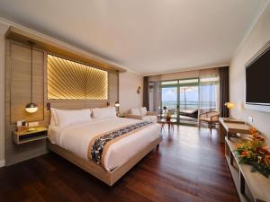 Кровать или кровати в номере Hilton Hotel Tahiti