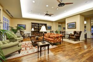 a living room with furniture and a ceiling fan at Hampton Inn & Suites North Charleston-University Boulevard in Charleston