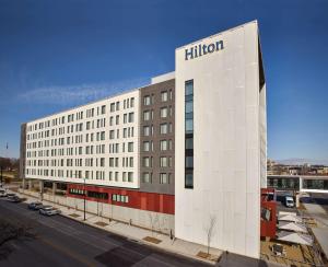 a building with a hilton sign on the side of it at Hilton Des Moines Downtown in Des Moines