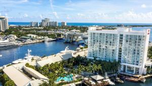 an aerial view of a city with a river and a building at Hilton Fort Lauderdale Marina in Fort Lauderdale
