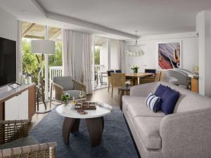 a living room with a couch and a table at Hilton Fort Lauderdale Marina in Fort Lauderdale
