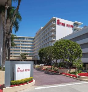 a building with a sign for the breyergy morgan hotel at The Beverly Hilton in Los Angeles