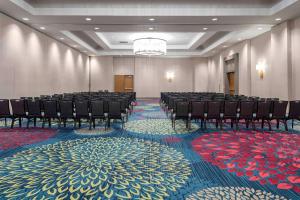 a large room with chairs and a large carpet at DoubleTree by Hilton Kansas City - Overland Park in Overland Park +38 photos