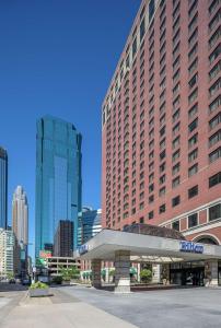a large building in a city with tall buildings at Hilton Minneapolis in Minneapolis