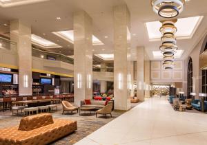 a lobby of a hotel with couches and chairs at Hilton Minneapolis in Minneapolis