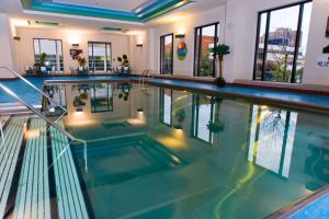a swimming pool in a house with a large pool at Hilton Minneapolis in Minneapolis