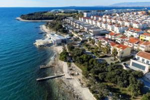 an aerial view of a town on the water at Apartments by the sea Petrcane, Zadar - 14327 in Petrcane