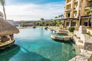 a swimming pool in the middle of a building at Oceanfront Penthouse, 2 Masters, 2 Baths, kitchen! in Cabo San Lucas